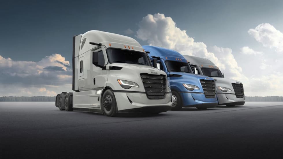 Three Freightliner fifth-generation Cascadia trucks are shown parked in a lineup, highlighting exterior design and aerodynamic styling.