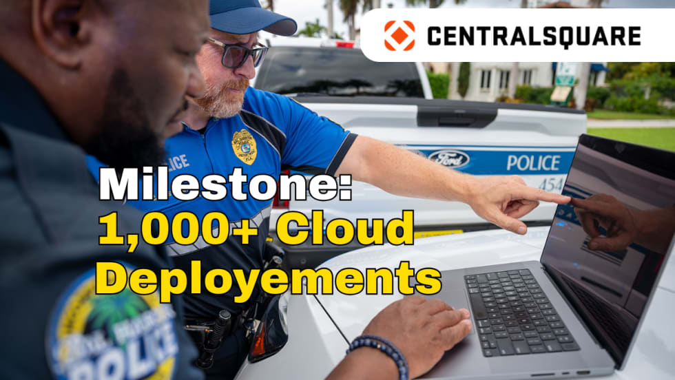 Image of two police officers working on a laptop with logo for CentralSquare and headline Milestone: 1,000+ Cloud Deployments.