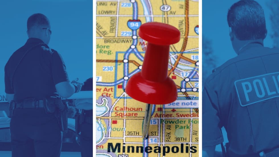 Red pushpin marking Minneapolis city map with police officers in background