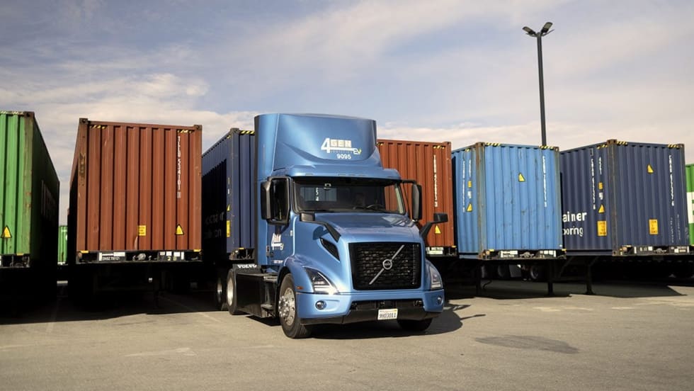 Electric Volvo VNR truck with intermodal containers at port
