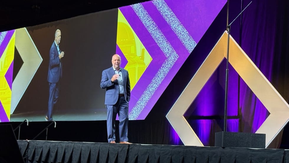 Man on convention stage