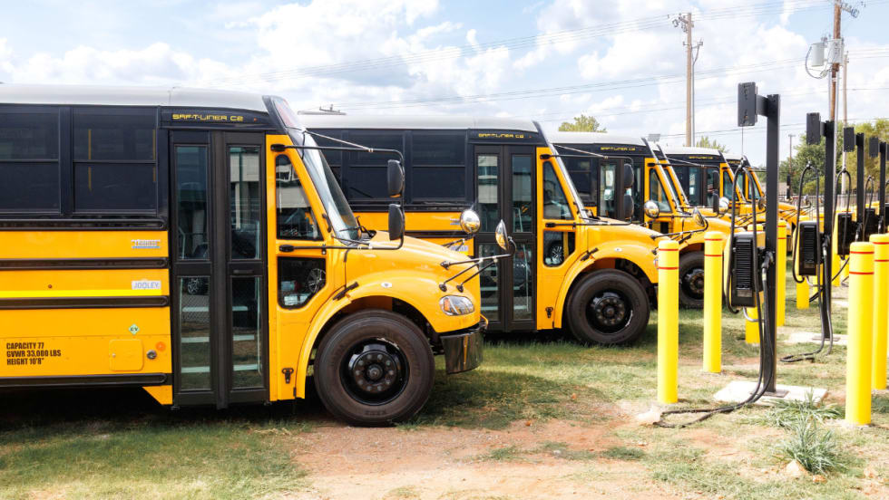 Electric buses parked at charging stations. 