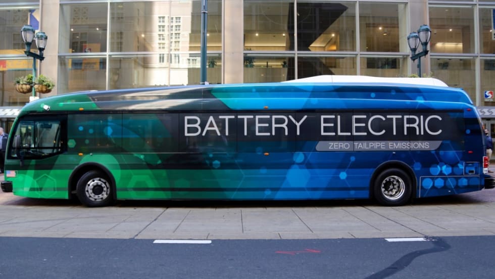 A side view of a blue and green battery electric SEPTA bus.