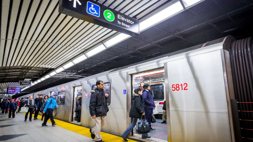 Riders boarding at a Toronto rail station.