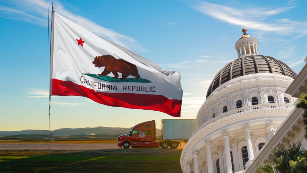California flag with autonomous truck in background.