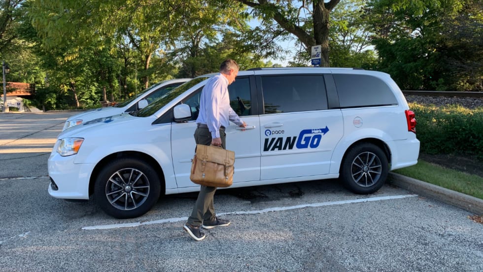 Driver enters Pace VanGo vehicle.