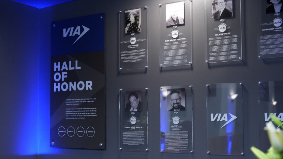 VIA's Hall of Honor wall with all inductees pictured.