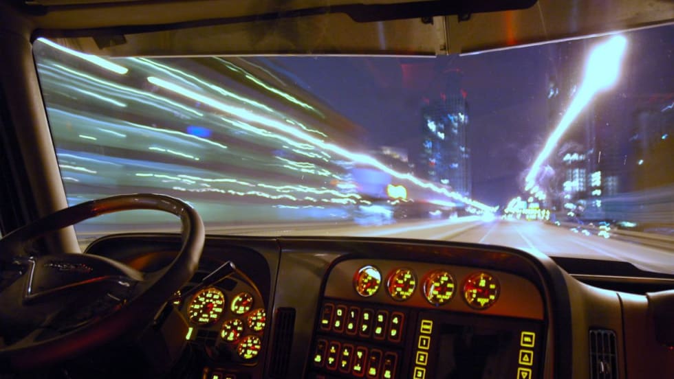 Blurry truck driver at night. 