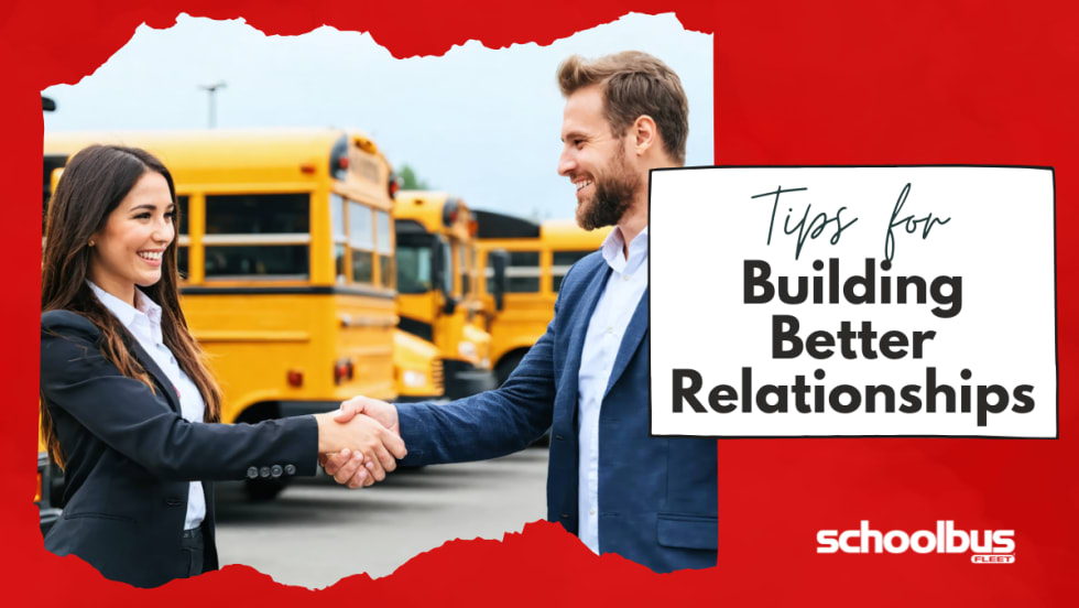  An image of a woman and a man, both dressed in professional attire, shaking hands in a school bus dealership lot surrounded by various buses.