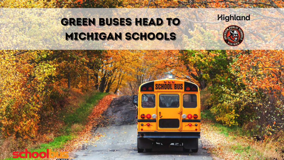 a school bus drives along a road in fall