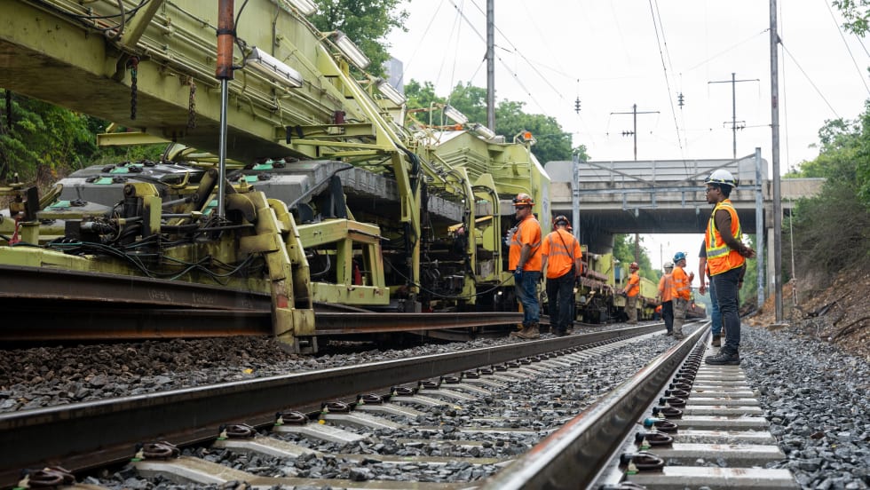 Workers replacing tracks along Amtrak's Harrisburg line.