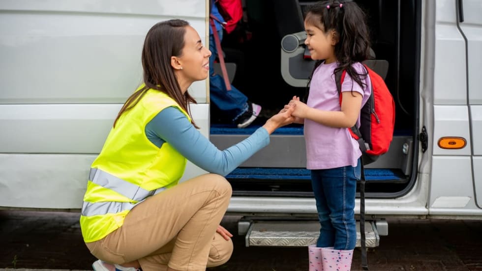 school bus driver with student
