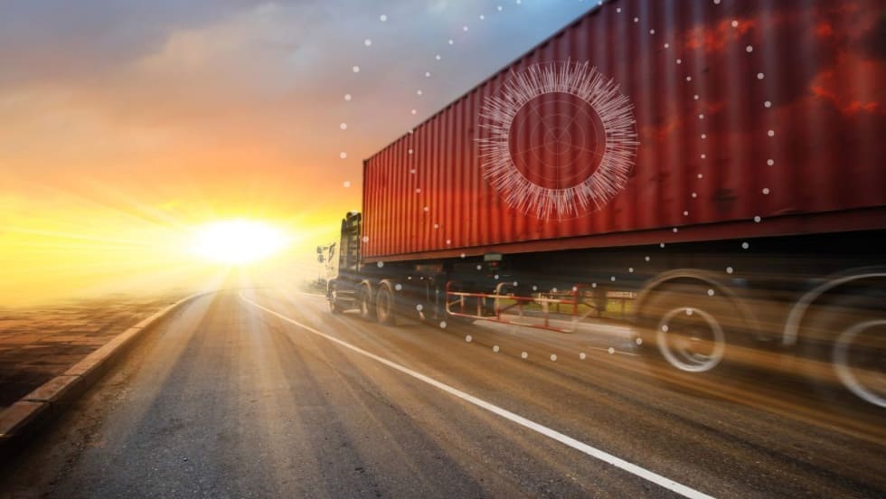 Illustration of an intermodal container on the road going into a sunset or sunrise with internet of things graphics.