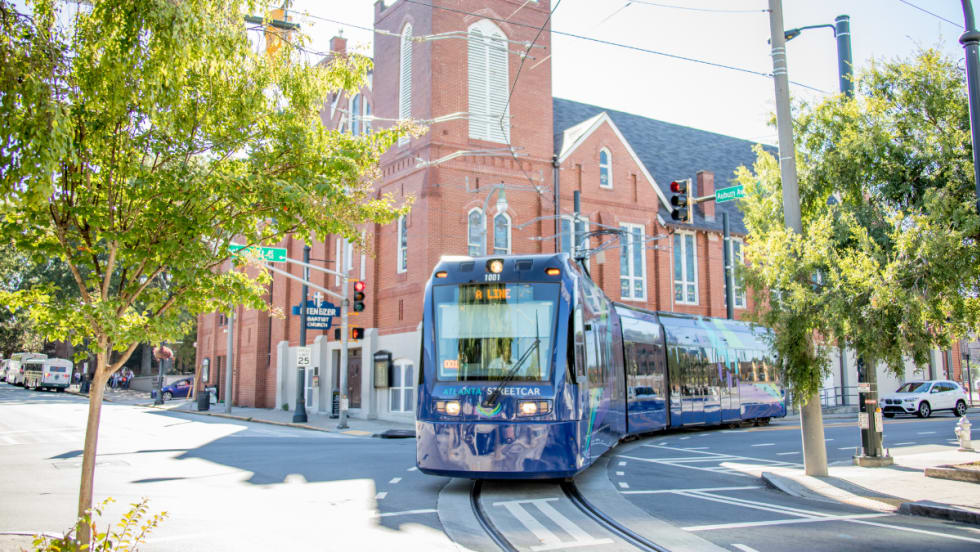 Blue A Line MARTA streetcar operating on the street.