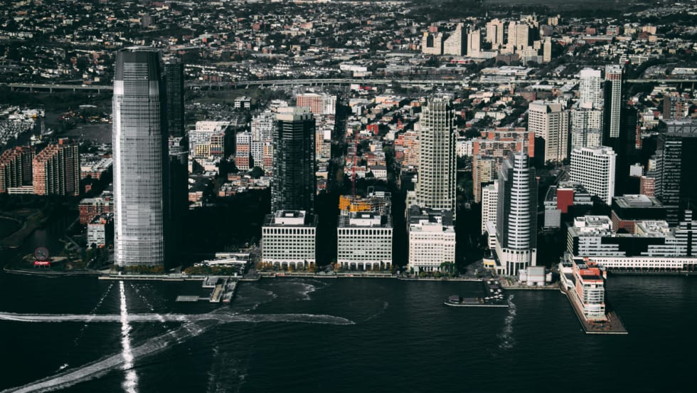 An aerial photograph of Jersey City, New Jersey, during the day.