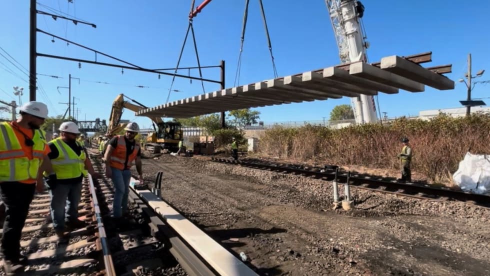 Image of construction workers working on a rail site.