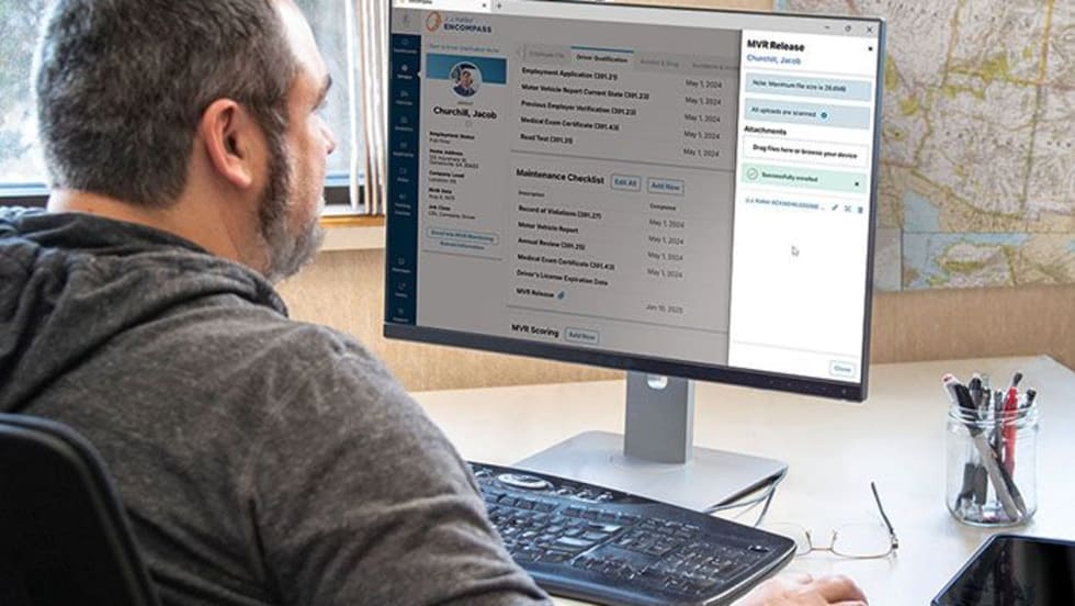 Shop manager with J.J. Keller fleet management system.