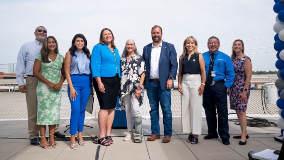 A group of CapMetro professionals posing for a photo.
