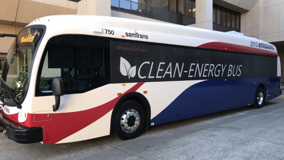 A red, white, and blue SamTrans clean-energy bus.