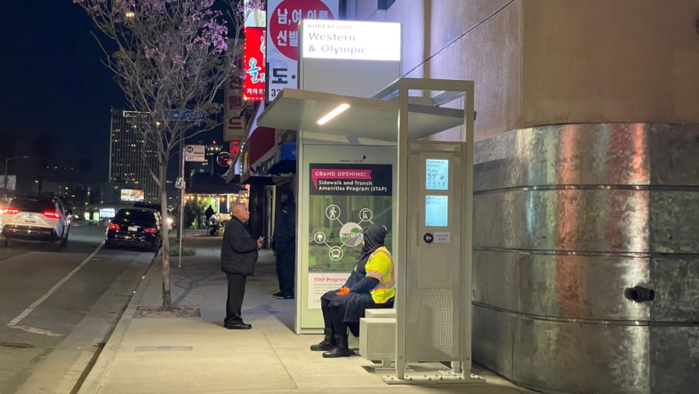 An LA Koreatown Tolar bus shelter at night.