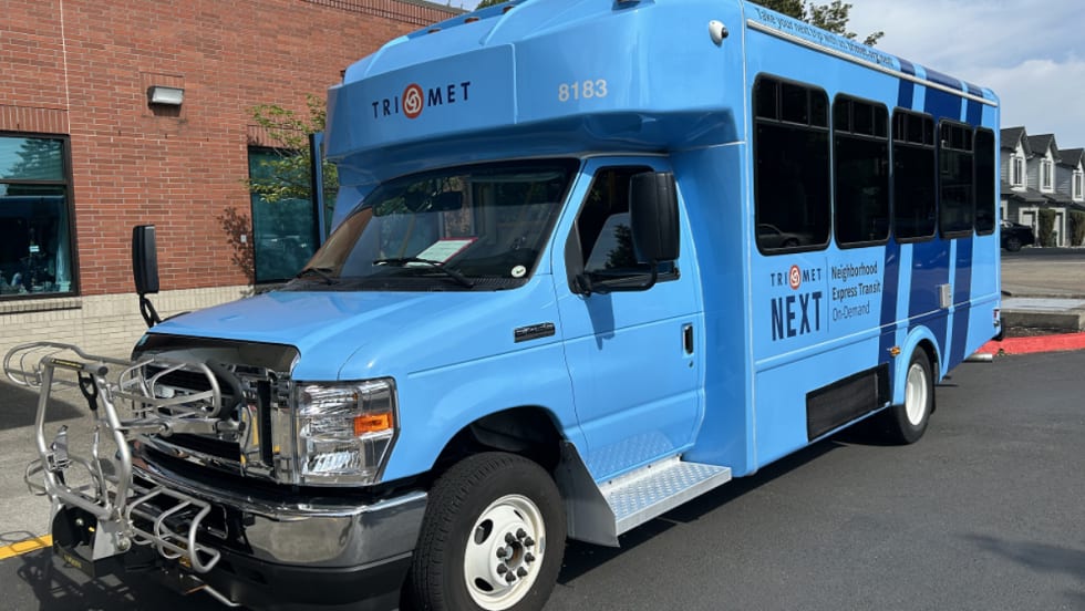 A blue TriMet NEXT bus.