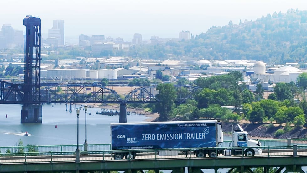 ConMet powered trailer crossing a bridge.