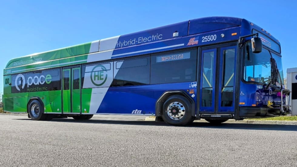 A green, white, and blue Pace bus.