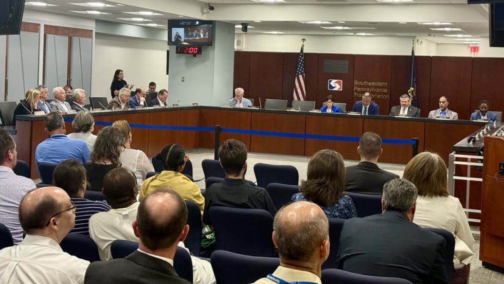 The SEPTA Board meets in a room.