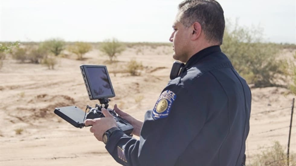 An officer is using a DJI Cendence controller with a DJI CrystalSky monitor to operate his agency's UAS, or drone. Photo: Michael Hamann