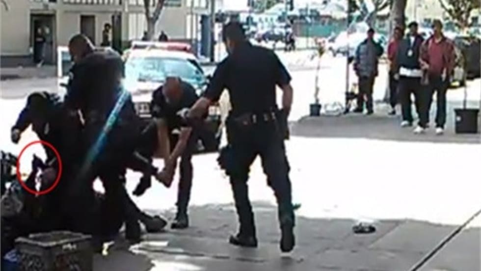 LAPD officers shot and killed a convicted bank robber Sunday after he reportedly tried to grab one of the the officers' guns.