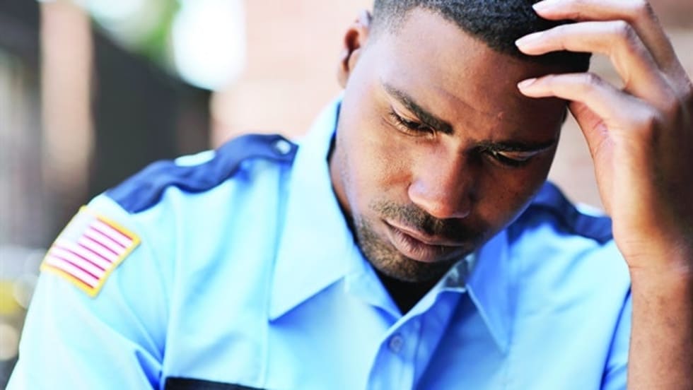 Many officers have a hard time finding somebody to talk to about what they are coping with. And most don't want to have to relive what precipitated the problem. Photo via Getty Images.