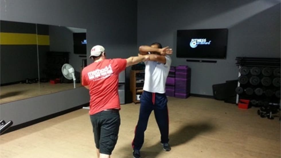 With your hands in a non-offensive position you can easily transition to this cover-up technique and to a strike.