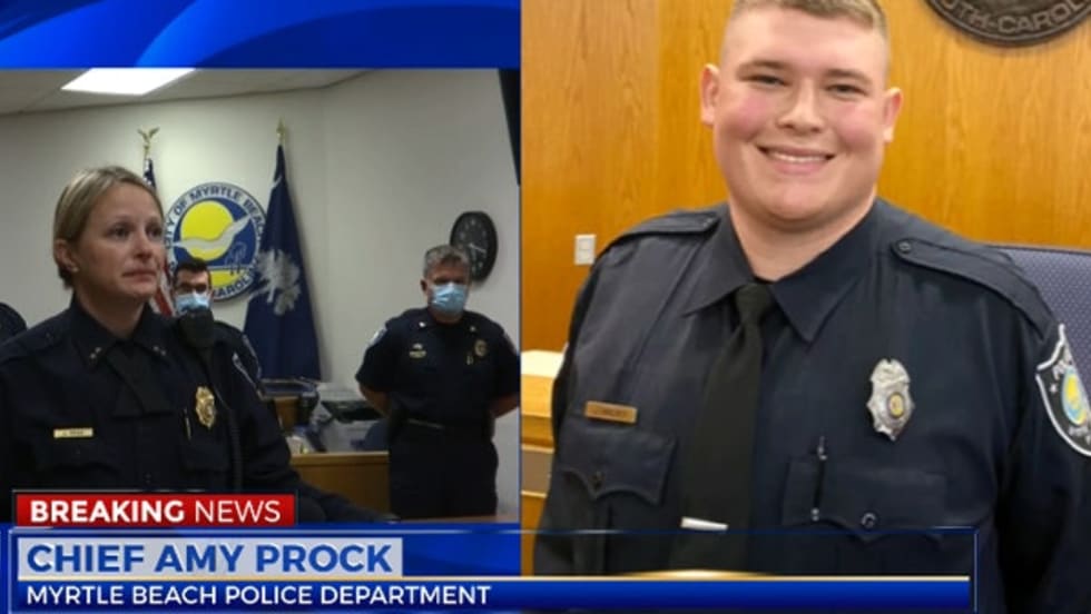 Officer Jacob Hancher was shot and killed as he responded to a call of a domestic dispute on Saturday night.[|CREDIT|]Screen grab of news report.