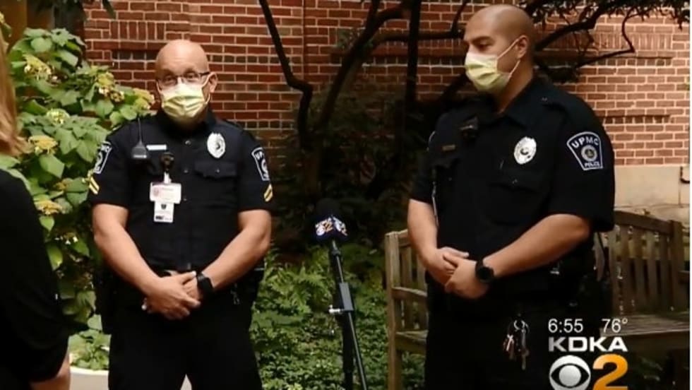 Officers Anthony Costa and Matthew Lisovich saved the life of a woman who was badly bleeding by applying a tourniquet and keeping her calm until other first responders were able to get to the scene.[|CREDIT|]Screen grab of news report.