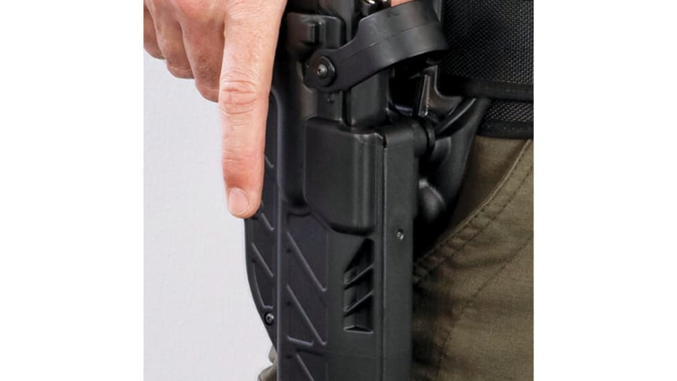 The Level 3 retention model of Gould & Goodrich’s T.E.L.R. holster features a hood that the wearer disengages with their thumb. They then can disengage the ejection port lock as they draw.[|CREDIT|]