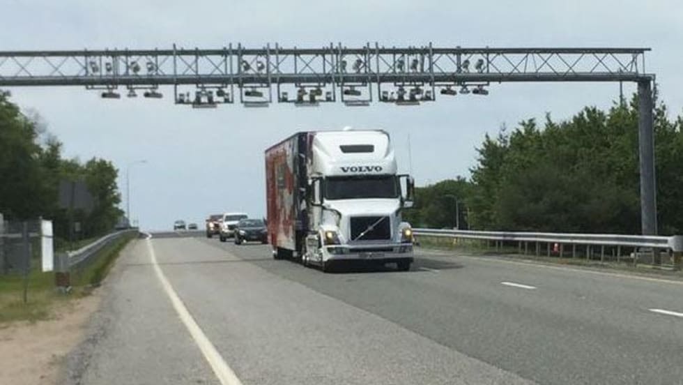 A truck passes under a toll gantry on the first day of Rhode Island's truck-only tolls in 2018