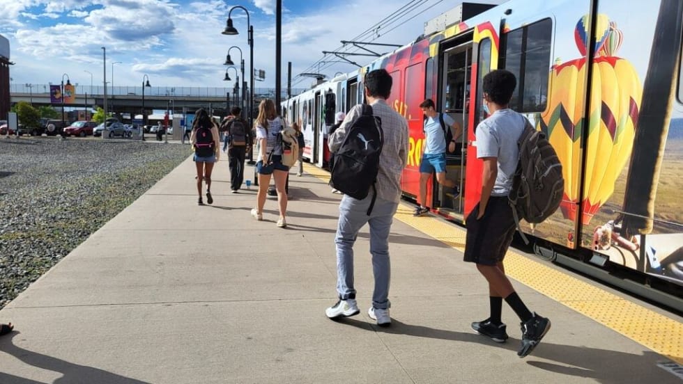 Young people on a Denver RTD railcar.