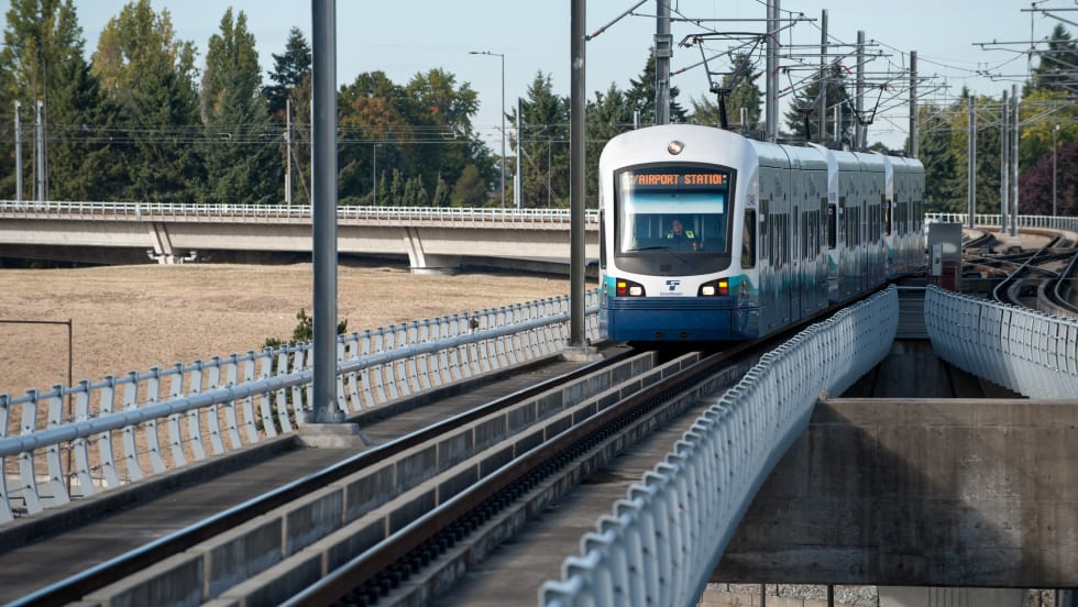 A Sound Transit train traveling along the tracks.