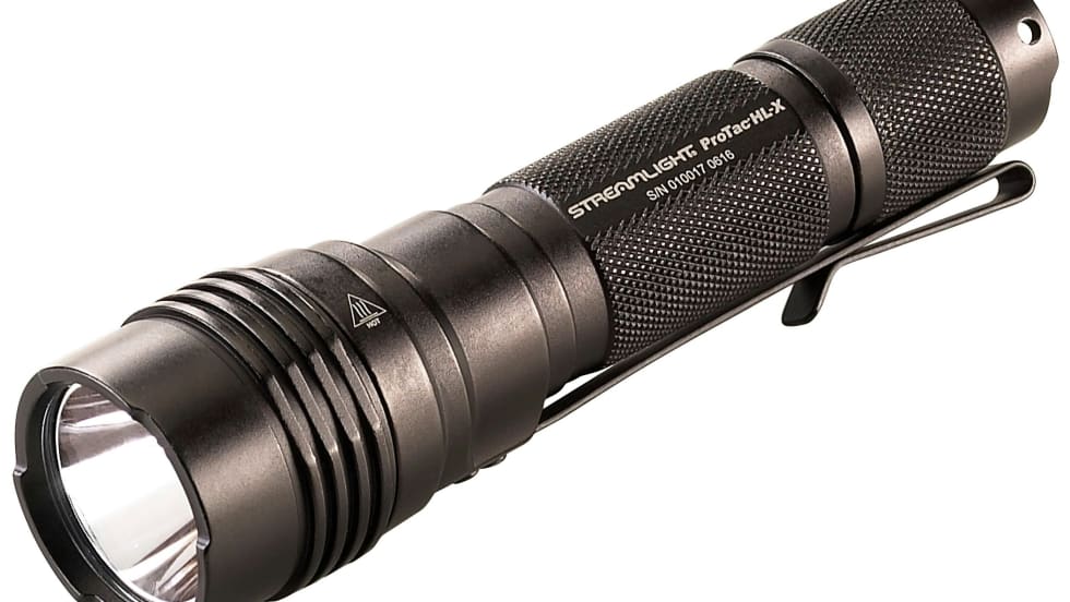 Black tactical LED flashlight with textured grip and bright lens