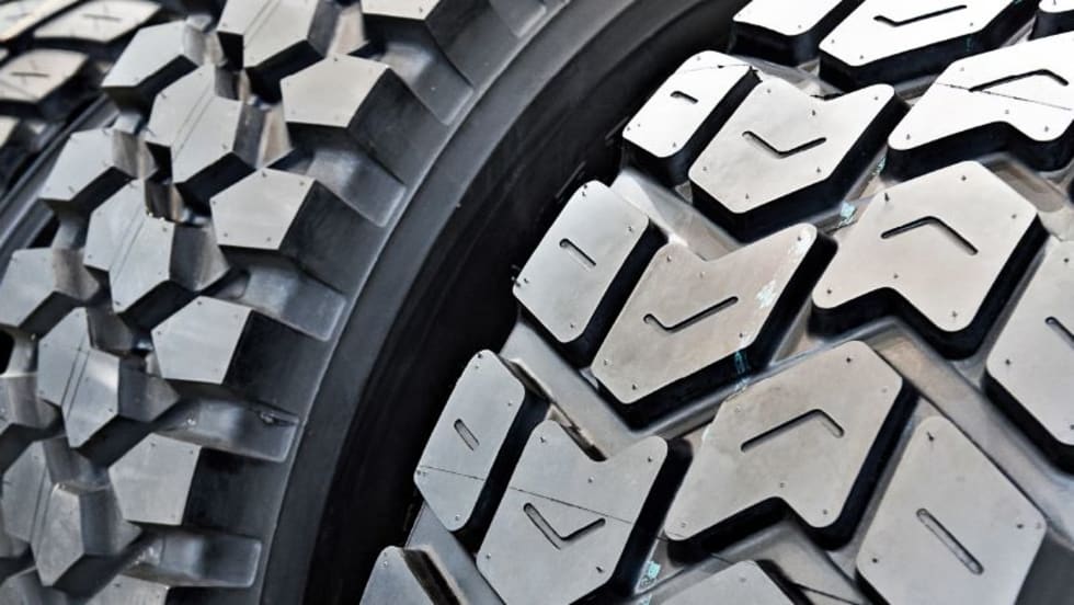 Closeup of truck tire treads.