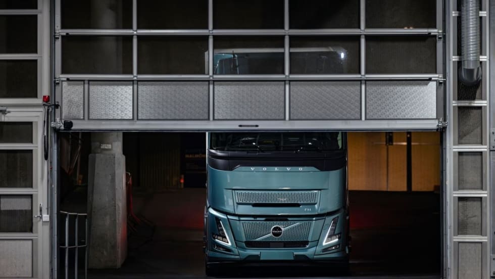 A Volvo FH Electric in a garage.