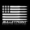 Bold black-and-white logo showing a U.S.-style flag formed from rifle cartridges and shell casings, with 'BulletPoint Mounting Solutions' brand text.