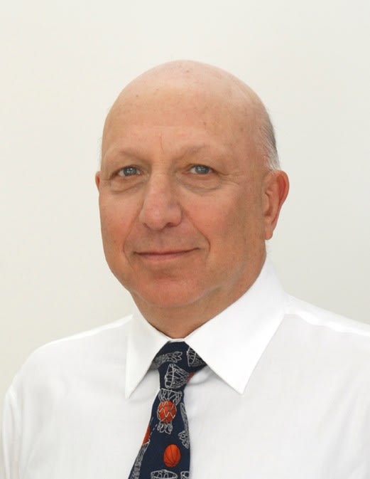 Pychotherapist Jonathan Berent in white shirt and colorful tie.