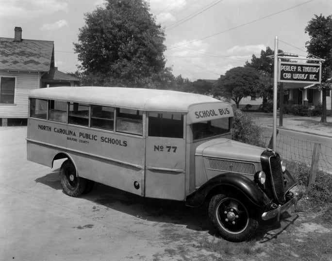 A black and white photo from 1936 of a Thomas Built school bus.