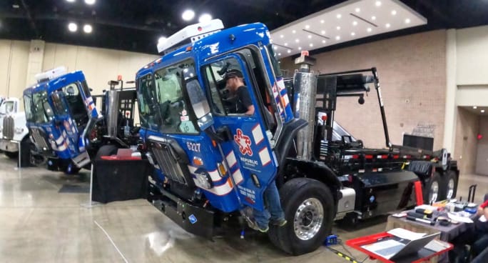 Waste Management truck cab titled forward for maintenance