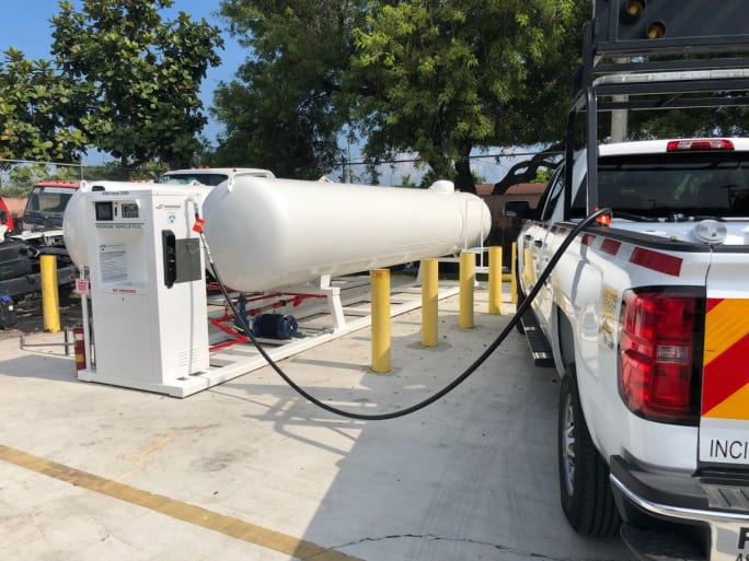 A white pickup being refueled with propane autogas