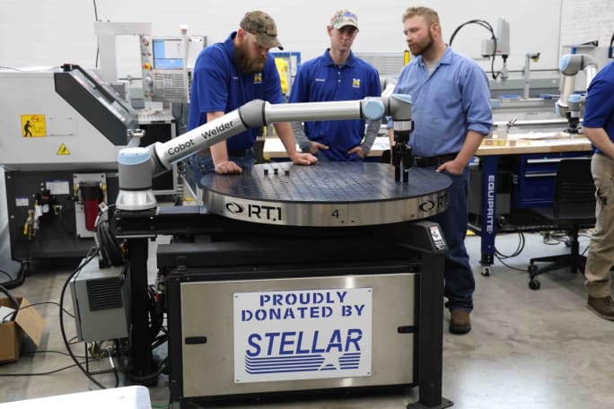 The Robotics team at North Iowa Area Community College using their new robot