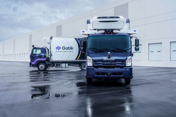 Two Isuzu trucks with Gatik logos