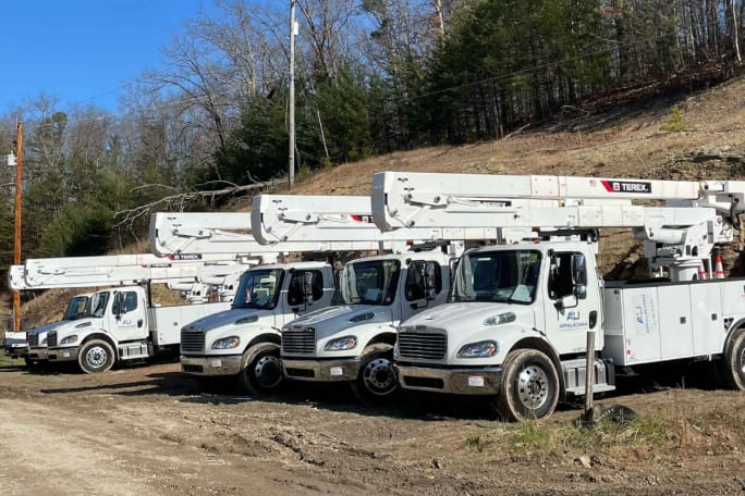 A fleet of work trucks