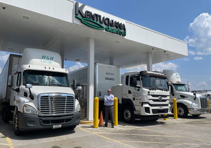 Trucks at natural gas fueling station